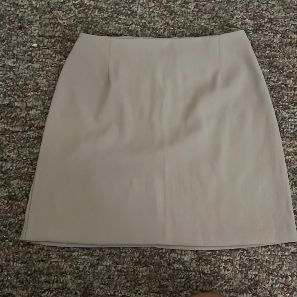Tan fitted mini skirt. size medium.